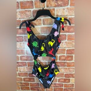 Women’s bright dinosaur print monokini with faux shoulder ties